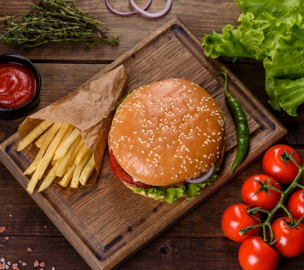 craft-beef-burger-and-french-fries-on-a-black-background-e1664111539632.jpg